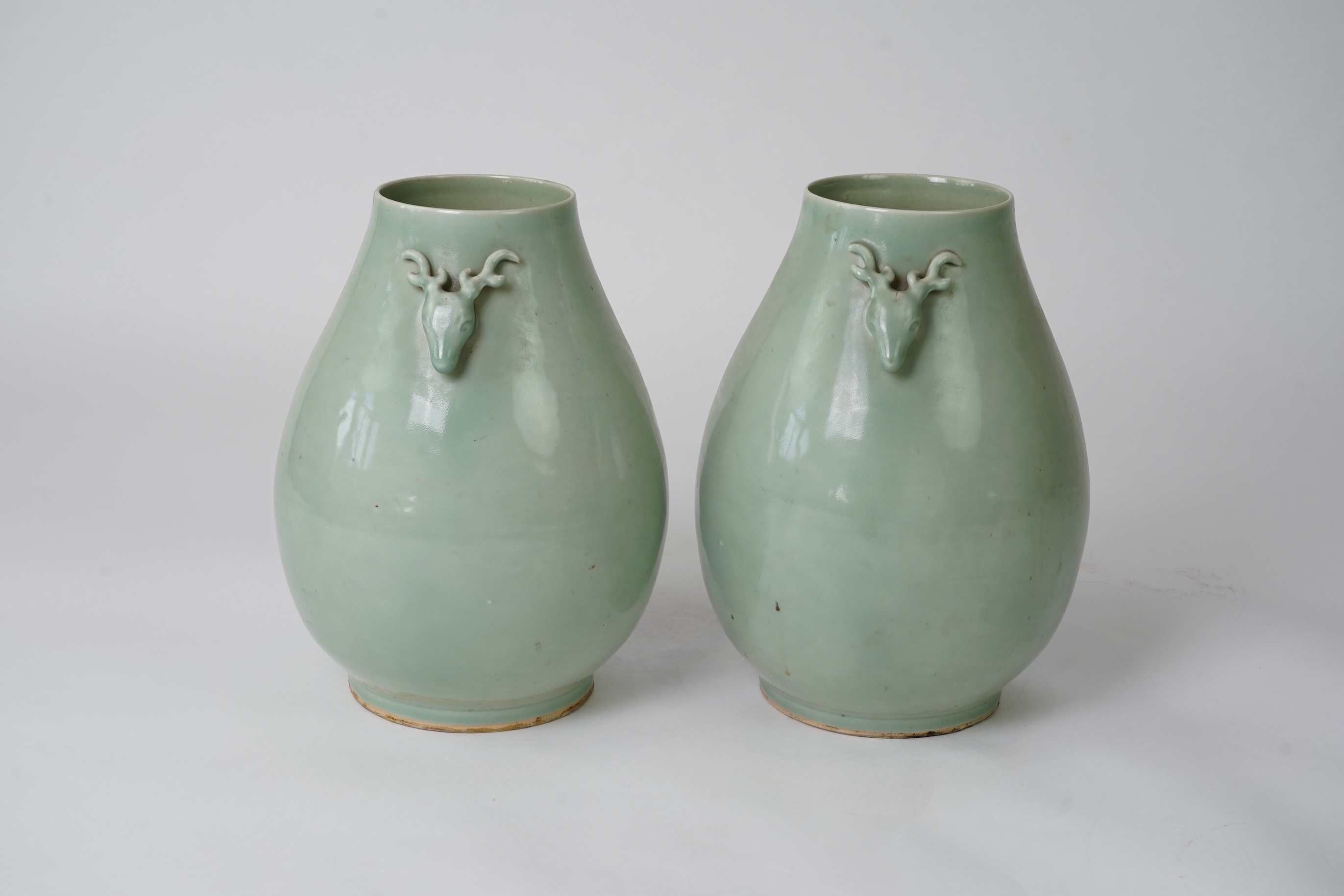 A pair of large Chinese celadon glazed ‘ hu’ vases, Yongzheng seal mark, 19th century